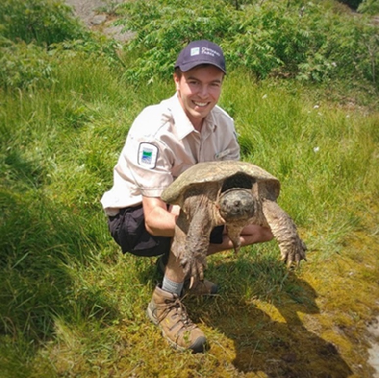 staff holding Snapping Turtle