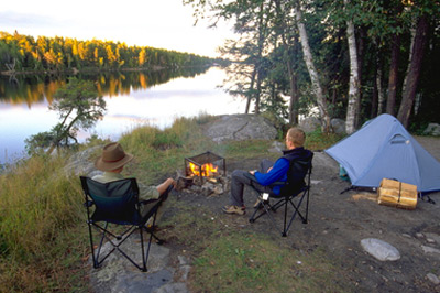 a tent on a campsite by the water