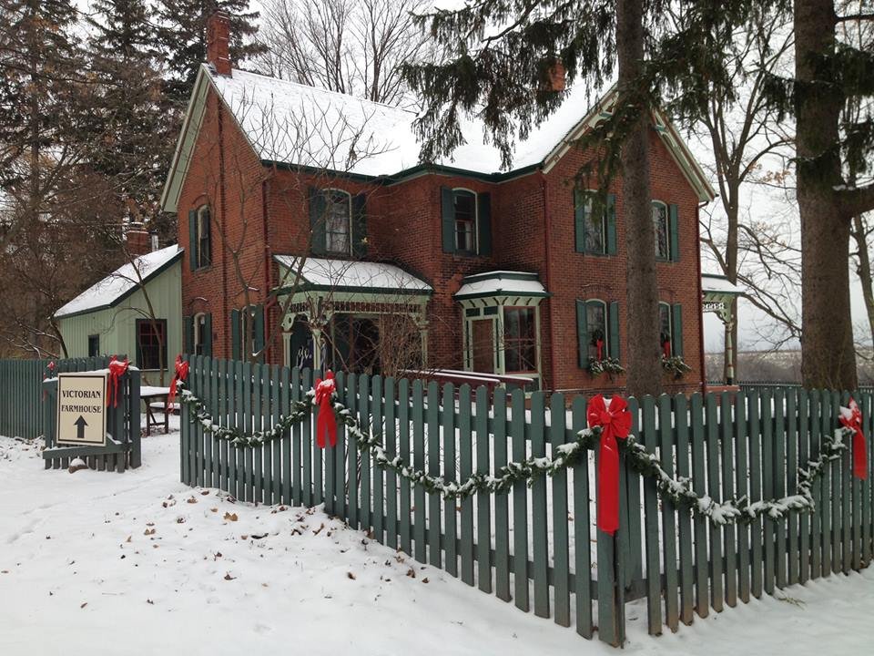 Exterior view of an 1890's Victorian Farmhouse decorated for Christmas.