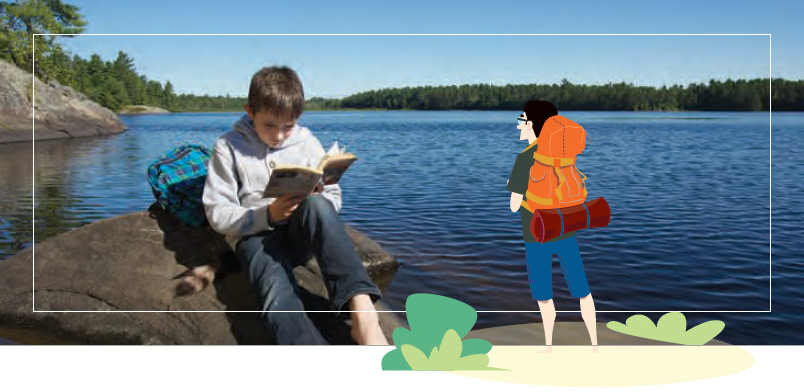 Boy reading on rock