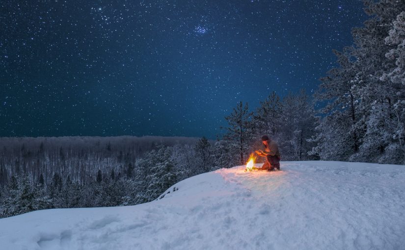 Campfire at night in winter