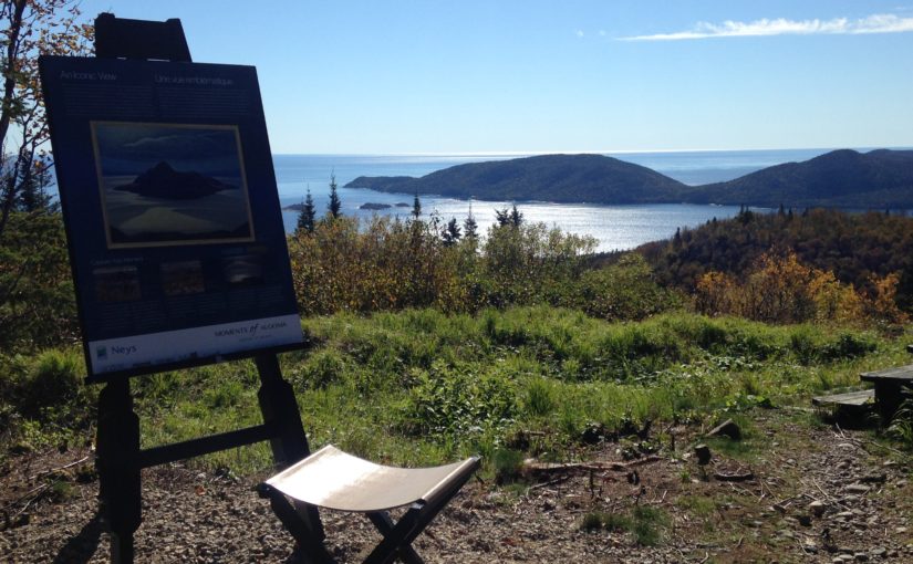 easel on hill overlooking lake