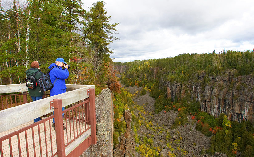 Fall photographers on Ouimet Canyon PP's viewing platform.