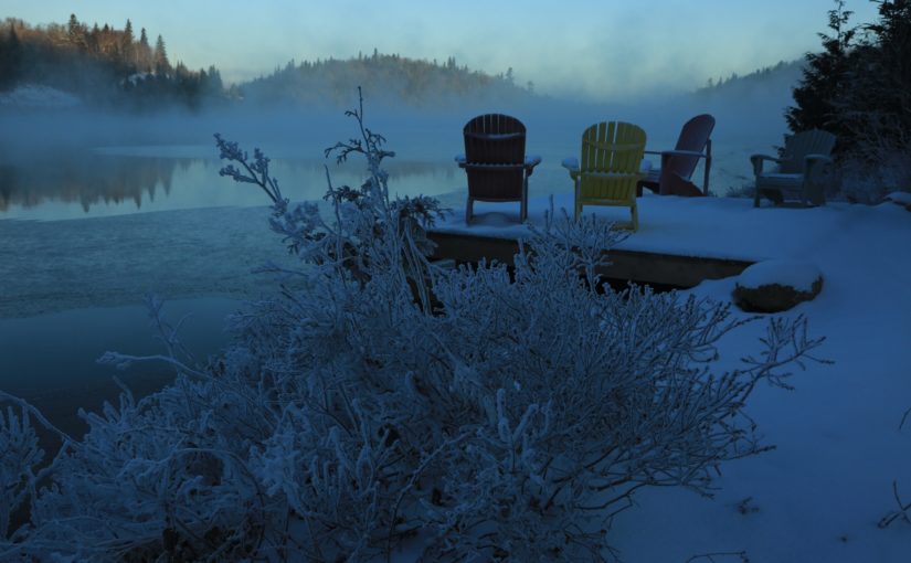 Colourful muskoka chairs on the Red Rock Lake dock, on a frosty and misty early winter morning; photo by Bob Elliott, Ontario Parks