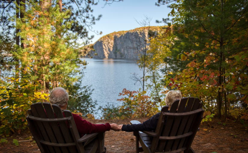 Couple enjoying the view of Mazinaw Rock from the Rustic Cabin