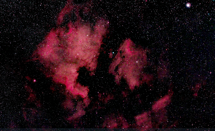 red gases on black starry sky